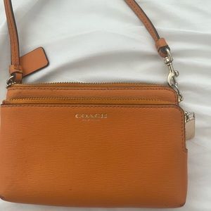 Coach wristlet orange color